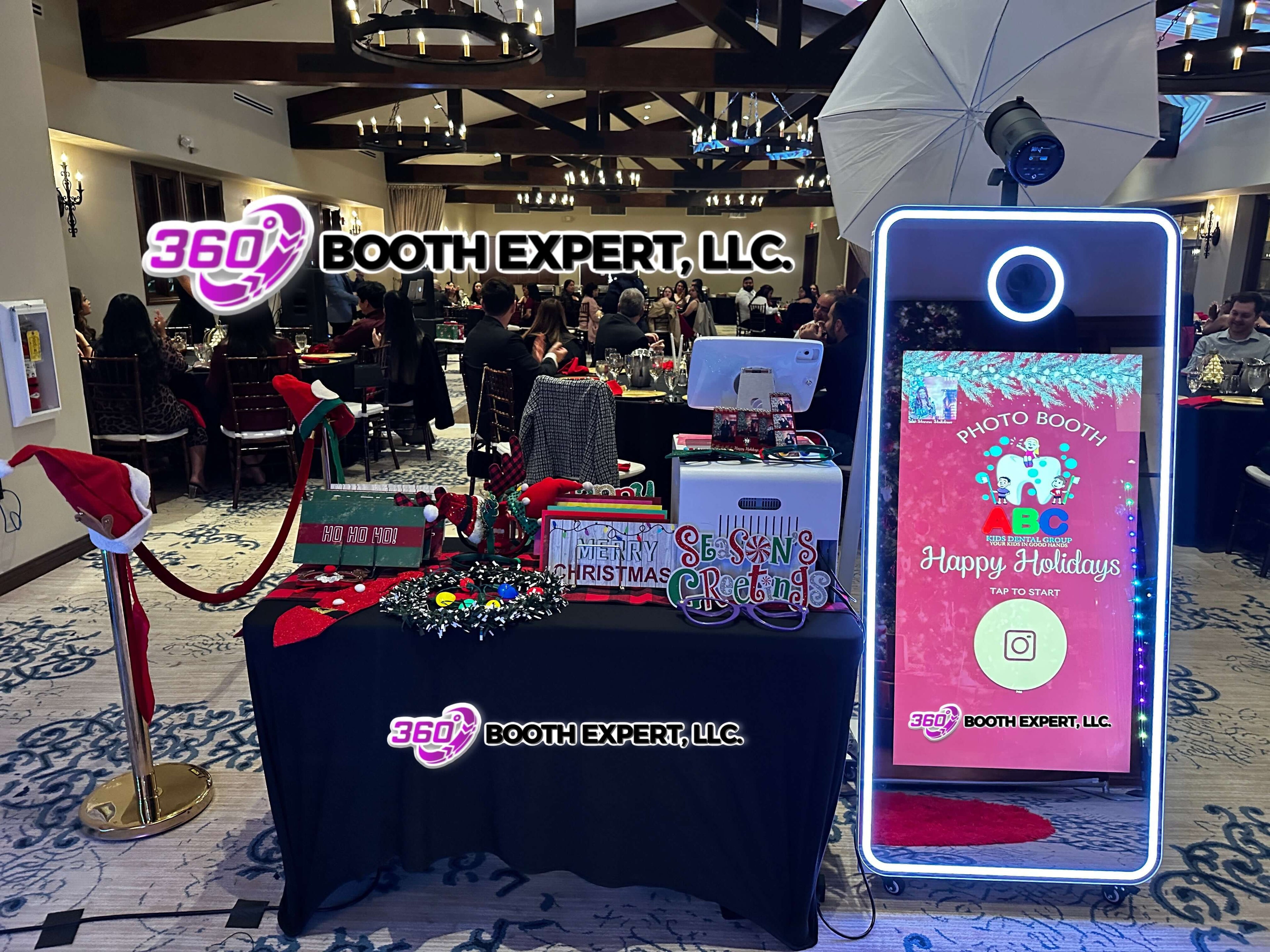 LRG mirror photo booth sale showcased at a holiday event with decorations and festive atmosphere.